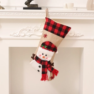 3D snowman Christmas stocking with red and black plaid on a white fireplace decor