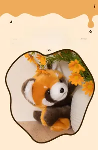 Detailed view of plush red panda hand puppet showing soft faux fur texture and cute face
