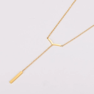 Detail of gold Y-shaped necklace with V-pendant and long rectangular bar drop