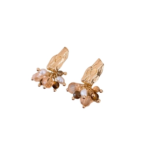 Vintage gold hammered metal earrings with elegant pearl tassels and amber stone beads