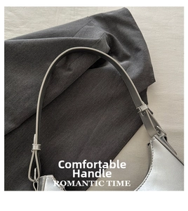 Detail of silver metallic leather bag showing adjustable shoulder strap and hardware