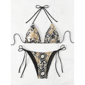 Flat lay of a two-piece snake print bikini with adjustable neck and side ties