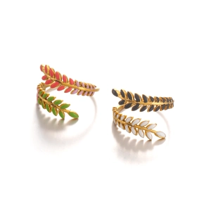 Golden leaf rings with colorful enamel drip detail for a trendy minimalist jewelry look
