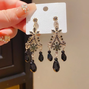 Detail of vintage palace style earrings with 925 silver needles and black crystals