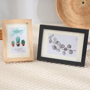 Minimalist wood photo frames in natural and black finish with white matting for desk display