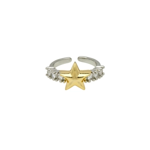 Detail of adjustable ring featuring a gold star center and clear zircon accents