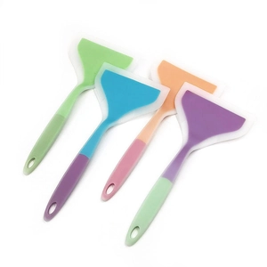 Detailed view of four colorful silicone spatulas with ergonomic handles and hanging holes