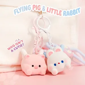 Cute cartoon pig and rabbit flying pet keychain set with matte finish for bag decoration