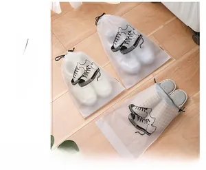 Three sizes of frosted drawstring travel bags for shoes and clothes on wooden floor