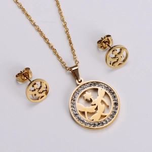 Detailed shot of gold-plated necklace and earrings set featuring fairy garden motifs