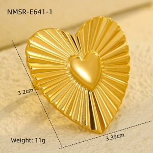 Detail view of golden heart ring with size 3.2cm by 3.39cm and textured finish