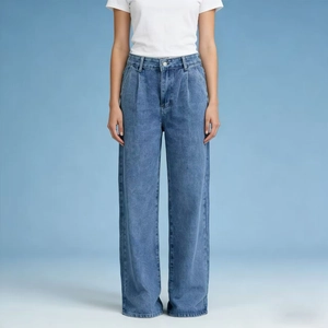 Close-up of high-waist blue wide-leg jeans showing the fabric texture and draped fit