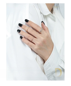 Close-up of minimalist S925 sterling silver rings with pave zircon inlay for women
