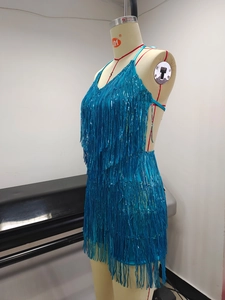 Detailed view of blue sequin fringe dress with shimmering tassels and deep V-neckline