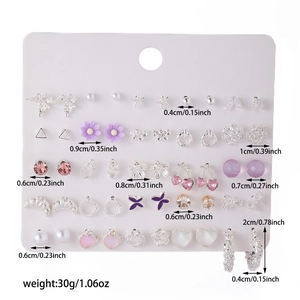 Detailed view of assorted earring set with measurements and various minimalist designs