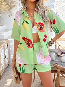 Close-up of tropical fruit and checkerboard print on lightweight two-piece vacation set