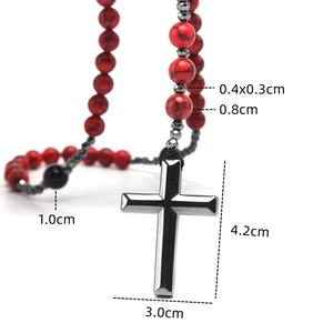 Detail view of 8mm red turquoise and black onyx beads with a 4.2x3.0cm cross pendant