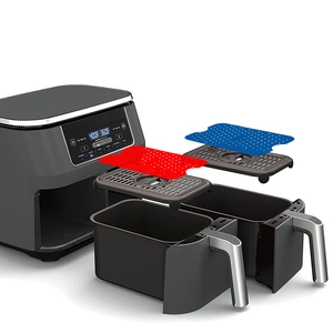 Dual basket air fryer set with two racks and red and blue silicone mats in explosion view