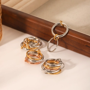 Minimalist stainless steel interlocking rings in silver gold and rose gold tones