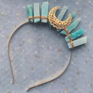 Close-up of Bohemian moon headband with blue raw stones and hand-wrapped golden wire