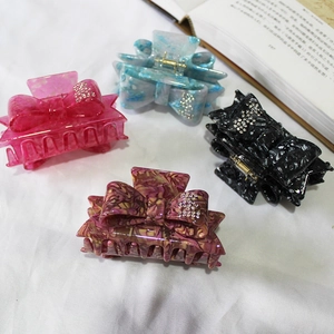 French style acetate hair claws with rhinestone bows in four marbled vibrant colors