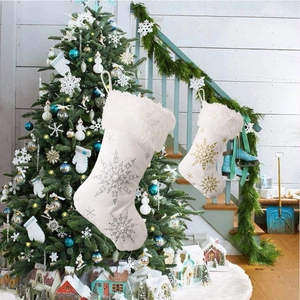 White velvet Christmas stockings with faux fur cuff and glittering metallic snowflakes