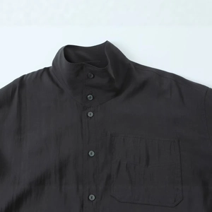 Women's black poplin shirt featuring a stand collar and breast pocket detail