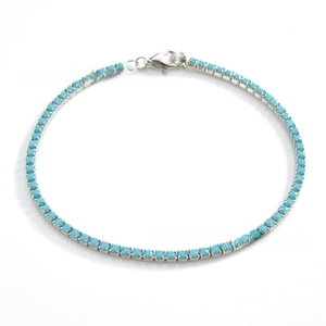 Detail of S925 silver tennis bracelet featuring turquoise beads and lobster clasp closure