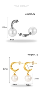 Detailed view of silver and gold knot earrings featuring large white round pearls