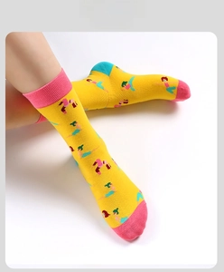 Detail of crew socks with yoga pattern colorful pink ribbing and yellow cotton knit