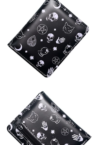 Detailed views of gothic skull and mystical prints on a black leather bifold wallet