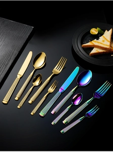 Polished gold and rainbow stainless steel cutlery set with roman pillar textured handles