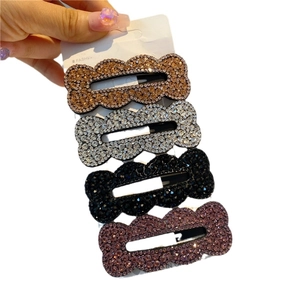 Set of four luxury rhinestone wavy hair clips in gold silver black and purple colors