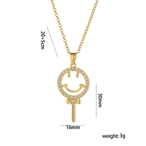 Collier sucette souriante en acier titane doré avec pavé de zircons brillants