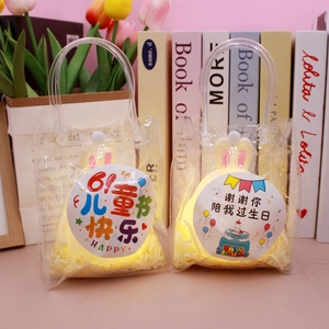 Detail of bunny ear night lights in PVC gift bags with Children's Day and Birthday stickers