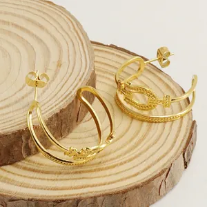 Boucles d'oreilles créoles C en acier inoxydable doré avec détails boucle fer à cheval