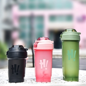 Three colorful plastic fitness shaker bottles with flip-top lids and Hi! logo branding
