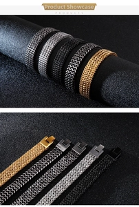 Detail of dragon bone chain bracelets in gold, silver, black, and grey finishes