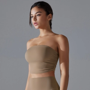 Detail view of ruching on slim fit strapless sports bra in breathable stretch fabric