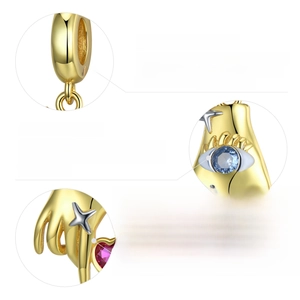 Detail showing 925 sterling silver stamp and cubic zirconia on gold plated charm