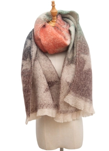 Detail of multi-color starry jacquard scarf with gradient fringe and chunky knit texture