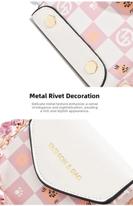 Detail of pink plaid crossbody bag with gold hexagonal rivets and silk scarf handle