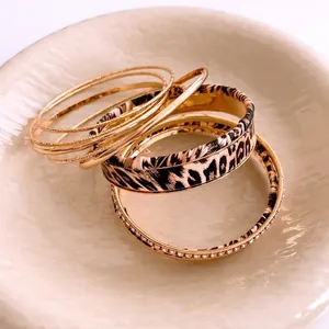 Bohemian style stackable gold bracelet set with leopard print and sparkling crystals