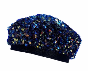 Detailed view of deep blue sequins and black knit edge on a stylish beret hat