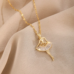 Macro detail of rose gold ballet dancer pendant with sparkling zircon crystals