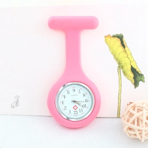 Close-up of a pink silicone nurse watch with medical cross icon and Arabic numerals