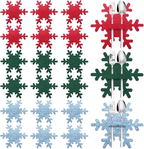 Detail view of colorful felt snowflake cutlery holders for Christmas table settings