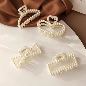Elegant 4-piece pearl hair claw clip set with heart and geometric shapes for women