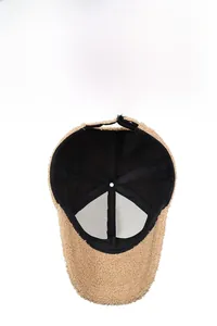 Detail view of the camel teddy fleece baseball cap interior with breathable mesh lining