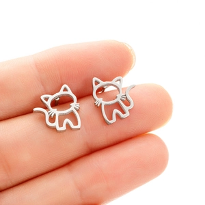 Minimalist silver kitten studs featuring delicate hollow-out metal cat silhouettes